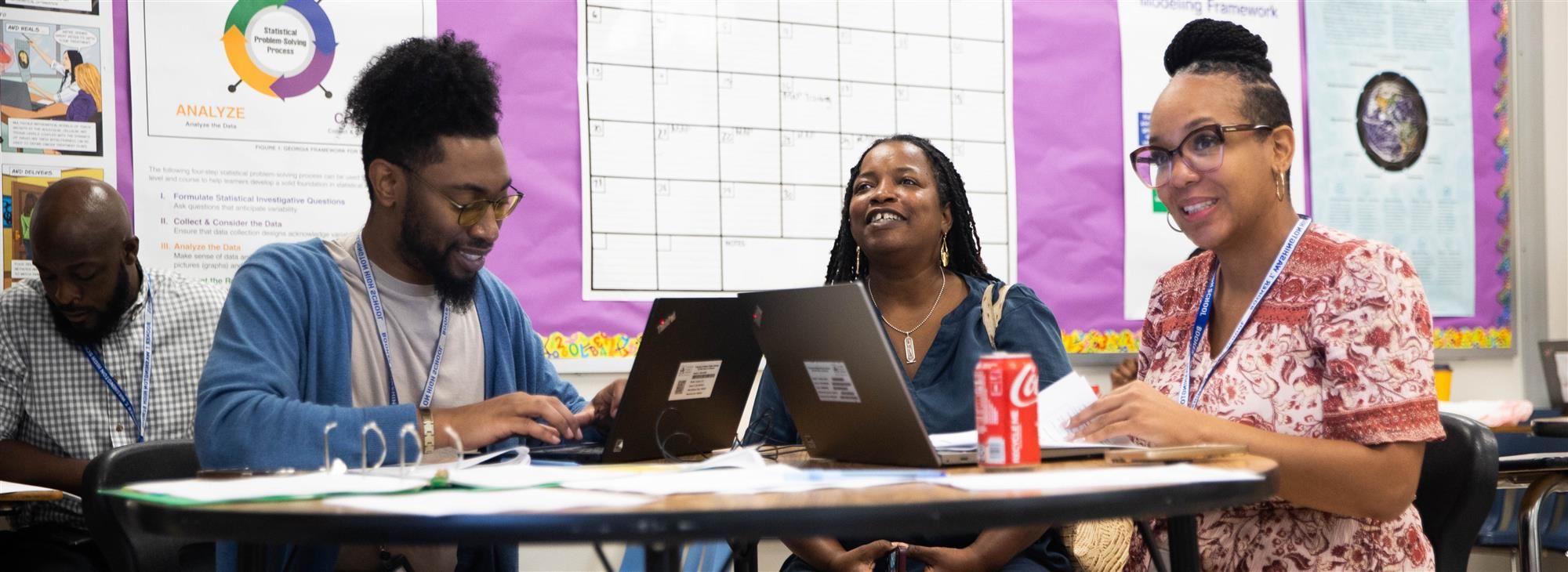 teachers at blackboard